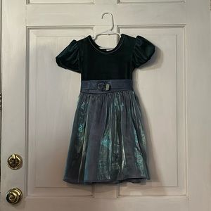 Green dress with shimmer skirt. Rose accent. Size 6
